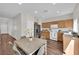 Bright kitchen features stainless steel appliances and eat-in dining area at 11164 African Sunset St, Henderson, NV 89052