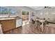 Open floor plan with eat-in dining area, kitchen, and living room at 11164 African Sunset St, Henderson, NV 89052