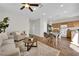 Inviting living space features a modern kitchen, dining area, cozy sofa, and abundant natural light for relaxation at 11164 African Sunset St, Henderson, NV 89052