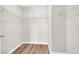 A tidy walk-in closet features wooden floors and white-wire shelving for optimal storage at 11164 African Sunset St, Henderson, NV 89052