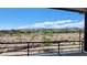 Enjoy the scenery from this balcony overlooking a desert landscape, neighborhood, and mountain views at 11593 Cedar Shore Ave, Las Vegas, NV 89138