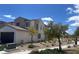 Modern two-story home featuring desert landscaping and attached two-car garage at 11593 Cedar Shore Ave, Las Vegas, NV 89138