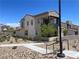 View of modern two-story home and desert landscaping at 11593 Cedar Shore Ave, Las Vegas, NV 89138