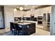 Elegant kitchen boasts stainless appliances, granite countertops, and a functional center island at 11593 Cedar Shore Ave, Las Vegas, NV 89138