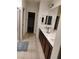 Bathroom featuring a walk-in shower, tile flooring, double vanity and framed mirrors at 11815 Corenzio Ave, Las Vegas, NV 89138