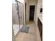 Bathroom featuring a walk-in shower, tile flooring, a long vanity and framed mirrors at 11815 Corenzio Ave, Las Vegas, NV 89138