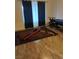 Room with a home gym and a pool table on wood-look flooring with a window dressed in dark curtains at 11815 Corenzio Ave, Las Vegas, NV 89138