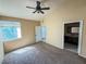 Spacious bedroom with carpet, a ceiling fan, and en suite bathroom access at 1300 S Arlington St # 202, Las Vegas, NV 89104