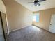 Carpeted bedroom with a closet and ceiling fan at 1300 S Arlington St # 202, Las Vegas, NV 89104