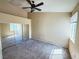 Spacious bedroom with carpet, a ceiling fan, and a mirrored closet at 1300 S Arlington St # 202, Las Vegas, NV 89104