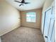 Bedroom with a ceiling fan, carpet flooring, a window, and a closet at 1300 S Arlington St # 202, Las Vegas, NV 89104