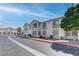 View of a condo complex with beige stucco and red tiled roofs at 1300 S Arlington St # 202, Las Vegas, NV 89104