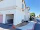 Inviting condo featuring a quaint facade, charming landscaping, and an attached garage at 1300 S Arlington St # 202, Las Vegas, NV 89104