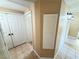 Neutral hallway with tile floors, closet, and lighting at 1300 S Arlington St # 202, Las Vegas, NV 89104