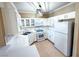 The kitchen features white cabinets, subway tile backsplash, and stainless appliances at 1300 S Arlington St # 202, Las Vegas, NV 89104