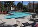 Beautiful community pool and patio area with lounge chairs and tables at 1300 S Arlington St # 202, Las Vegas, NV 89104