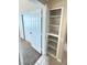 Hallway linen closet with open shelving at 1300 S Arlington St # 202, Las Vegas, NV 89104