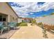Inviting backyard features a spa, artificial grass, and outdoor patio area for entertaining guests at 1401 Cattail Falls St, Boulder City, NV 89005