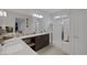 Bright bathroom featuring a double sink vanity, walk-in shower, and tile floors at 1401 Cattail Falls St, Boulder City, NV 89005