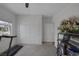 Bright bedroom with carpet, window, closet, ceiling fan, and minimal furnishings at 1401 Cattail Falls St, Boulder City, NV 89005