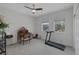 Bedroom featuring carpeted floors, a ceiling fan, and an exercise machine at 1401 Cattail Falls St, Boulder City, NV 89005