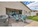 Covered patio featuring an outdoor kitchen and dining area overlooking the home's backyard at 1401 Cattail Falls St, Boulder City, NV 89005