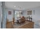 A cozy dining room with a wooden table, chairs, and a chandelier, creating an inviting space at 1401 Cattail Falls St, Boulder City, NV 89005