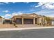 Charming single-story home with a well-manicured front yard and a three-car garage at 1401 Cattail Falls St, Boulder City, NV 89005