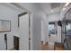 Hallway featuring an open doorway, cabinetry, and artwork at 1401 Cattail Falls St, Boulder City, NV 89005