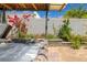 Inviting hot tub with beautiful landscaping creating a relaxing outdoor space at 1401 Cattail Falls St, Boulder City, NV 89005