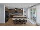 Open kitchen with a large island, stainless steel appliances, and sliding doors to the backyard at 1401 Cattail Falls St, Boulder City, NV 89005