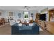 Cozy living area with a comfortable blue sofa and hardwood floors, perfect for relaxation at 1401 Cattail Falls St, Boulder City, NV 89005