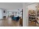 Open-concept living space with wood floors, a comfortable seating area, and well-stocked pantry at 1401 Cattail Falls St, Boulder City, NV 89005