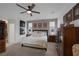 Spacious main bedroom featuring a ceiling fan, carpeted floors, and dresser at 1401 Cattail Falls St, Boulder City, NV 89005