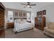 Spacious main bedroom featuring a ceiling fan, carpeted floors, and dresser at 1401 Cattail Falls St, Boulder City, NV 89005