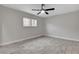 Bedroom featuring gray wood-look tile flooring, ceiling fan and a window with bars at 1708 Poplar Ave, Las Vegas, NV 89101