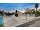 Inviting property with a carport, eye-catching chimney feature, and fenced yard for added privacy and charm at 1708 Poplar Ave, Las Vegas, NV 89101