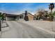 Attractive house featuring a carport, unusual chimney design, and well-maintained landscaping with a gated yard at 1708 Poplar Ave, Las Vegas, NV 89101