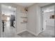 Hallway featuring floating shelves, gray wood-look tile flooring and doorways to other rooms at 1708 Poplar Ave, Las Vegas, NV 89101