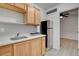 Cozy kitchen with stainless steel appliances, wood cabinets, and open layout at 1708 Poplar Ave, Las Vegas, NV 89101
