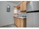 Efficient kitchenette features compact appliances, wood cabinets and a stainless steel sink at 1708 Poplar Ave, Las Vegas, NV 89101