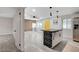 Open-concept kitchen with stainless steel appliances, decorative island and easy access to the living room at 1708 Poplar Ave, Las Vegas, NV 89101