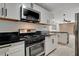 Modern kitchen featuring stainless steel appliances, sleek black countertops, and decorative kitchen island at 1708 Poplar Ave, Las Vegas, NV 89101