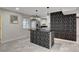 Stylish kitchen with stainless steel appliances and a unique geometric textured accent wall and island at 1708 Poplar Ave, Las Vegas, NV 89101