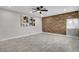 Comfortable living area with wood-look accent wall, contemporary flooring, and natural light from the window at 1708 Poplar Ave, Las Vegas, NV 89101