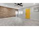 Welcoming living area with a stylish accent wall, modern flooring, and a bright, inviting atmosphere with outside view at 1708 Poplar Ave, Las Vegas, NV 89101
