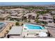 Expansive aerial view showcasing a luxury pool and spa in a desert community with scenic mountain views at 2 Olympia Outlook Dr, Las Vegas, NV 89141