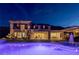 Stunning backyard featuring a sparkling pool, inviting spa, covered outdoor kitchen, and expansive patio for luxurious outdoor living at 2 Olympia Outlook Dr, Las Vegas, NV 89141