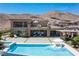 Inviting backyard with a pool, spa, and patio, set against a backdrop of scenic mountains at 2 Olympia Outlook Dr, Las Vegas, NV 89141