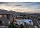 Luxury backyard with a sparkling pool, spa, desert landscaping, and mountain views at 2 Olympia Outlook Dr, Las Vegas, NV 89141